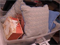 Container of decorative pillows, memory boxes