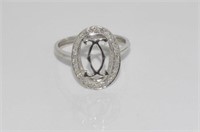 18ct white gold and diamond ring with double C