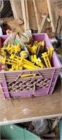 Purple crate of fencing supplies