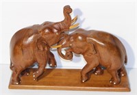 carved teak elephant figurine