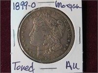 1899 (O) MORGAN SILVER DOLLAR 90% TONED AU