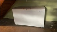 Scrap deep freezer in basement bring help to load