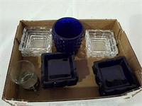 Clear and blue salt dips and votive all mark