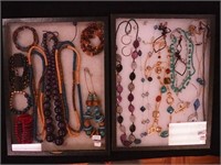 Two containers of costume jewelry: Juicy
