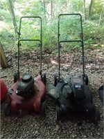 Two push mowers needing repair
