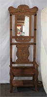 Wood hall tree with carved back and mirror,