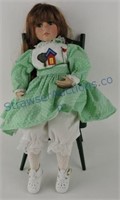 Porcelain doll with chair