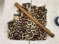 Leopard print fur and Billy club