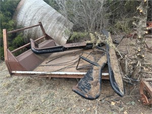 Flat bed with bale spike, pipe bumper and