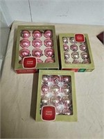 Three boxes of vintage pink glass ornaments