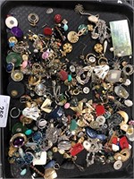 Tray of assorted earrings.