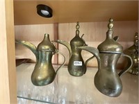 3- brass pitchers. Flip lids, unique