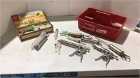 Assorted veterinary syringes and needles (some