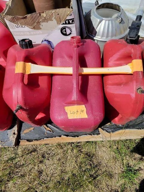 Three red five gallon gas cans