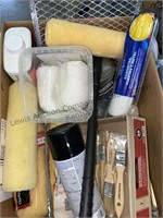 Box of painting supplies roller, brushes,
