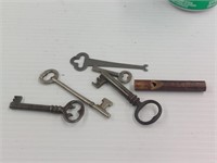 Skeleton keys and wooden handmade whistle works