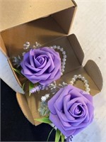 Two purple corsages