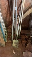 Assortment of shovels and various gardening tools