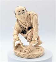Carved Composite Okimono Of Sailor With A Rope