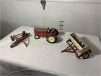 Toy tractor, hay rake, and seeder drill