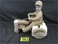 Resin Statue of Boy Riding on McCormick-Farmall Tr