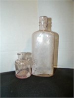 2 vintage pink tint clear glass bottles