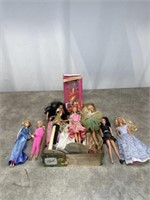 Assortment of Barbie and Disney dolls