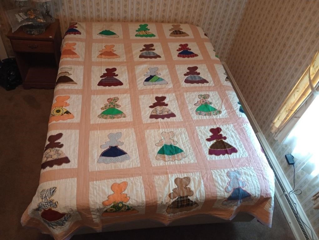 Hand and machine stitched sun bonnet Sue quilt.