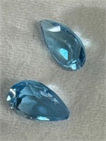 Pair of pear shaped light blue topaz