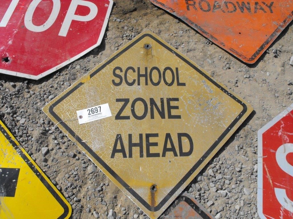 metal sign "School Zone Ahead"