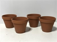 Four terra cotta planter pots