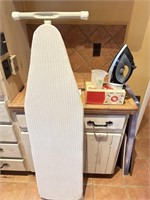 Ironing board with iron