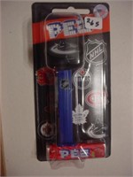 PEZ NHL Vancouver Canucks ice hockey puck, sealed