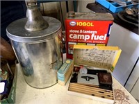 Typewriter letters, Esso Camp Fuel tin, and