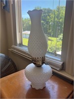 Cracked repaired milk glass lamp