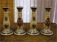 Four ceramic candlesticks