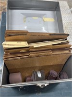 Variety of sandpapers organized in metal file box