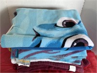 Stack of kids throws & towels