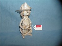 Artist signed hand glazed clay fireman figure