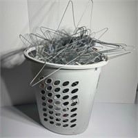 Laundry Basket Full Of metal Hangers