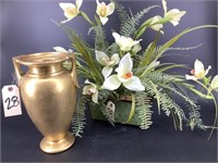 Gold urn and artificial flower arrangement