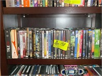 SHELF WITH VCR AND DVDS MISC TITLES AND AUTHORS