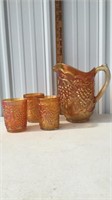 Imperial grape carnival glass pitcher and three