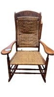 Antique rocker with rush bottom back and seat