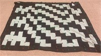 Black and green quilt, with yarn tie offs,  solid