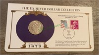 Coin - 1879 Morgan silver dollar with stamps and