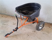 Agri-fab tow behind grass spreader.