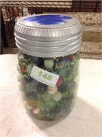 Bank jar of assorted marbles