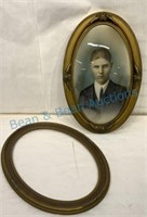 Oval portrait of a young man with an extra frame