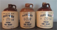 (3) Platte Valley corn whiskey jugs. Measures: 7"